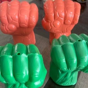 Plastic fist from hulk and the thing from the fantastic 4.